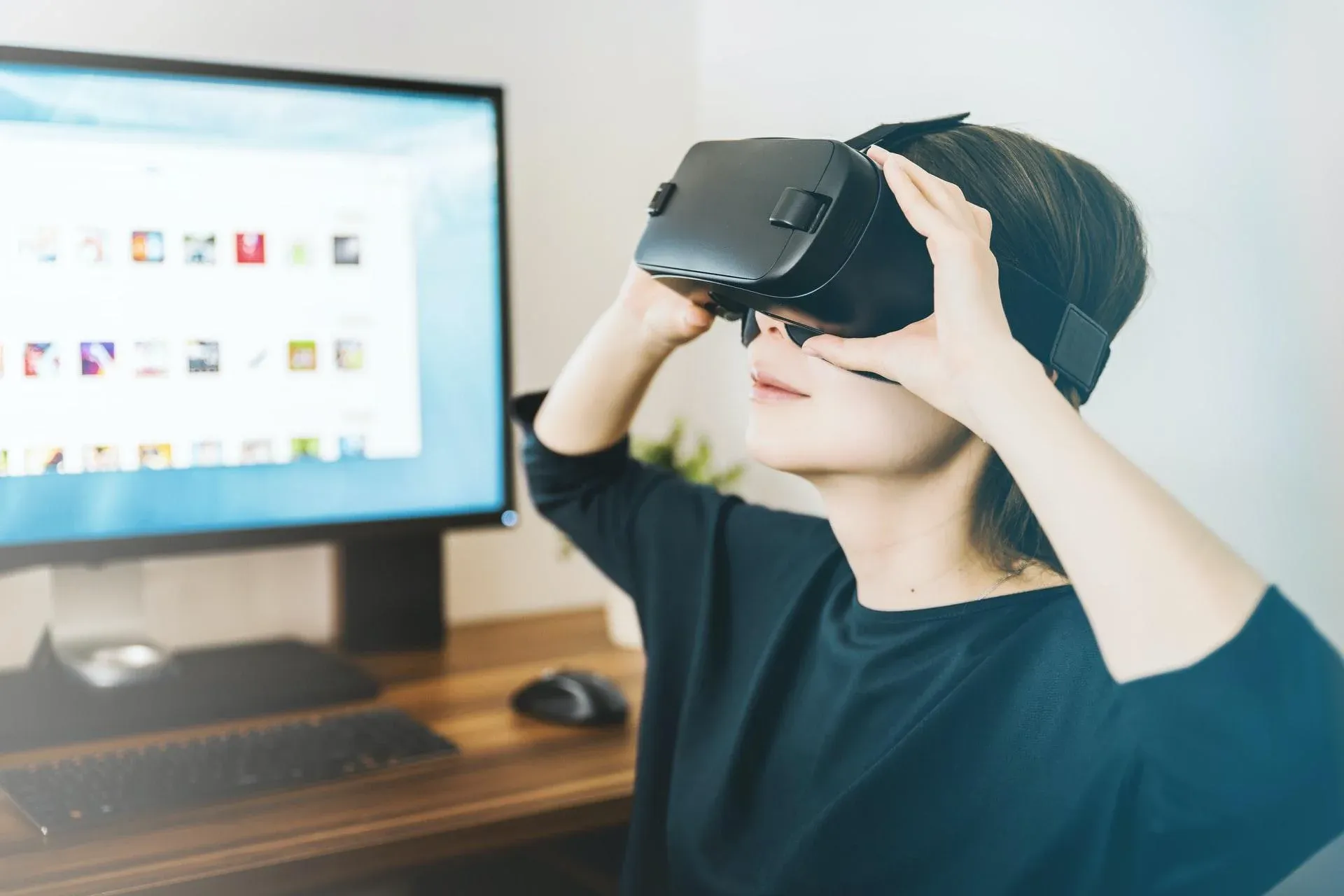 "A student sits at her desk at home with a VR headset at home. Virtual reality is one of the ways homeschool families are expanding their curriculum in new and innovative ways to keep their kids engaged